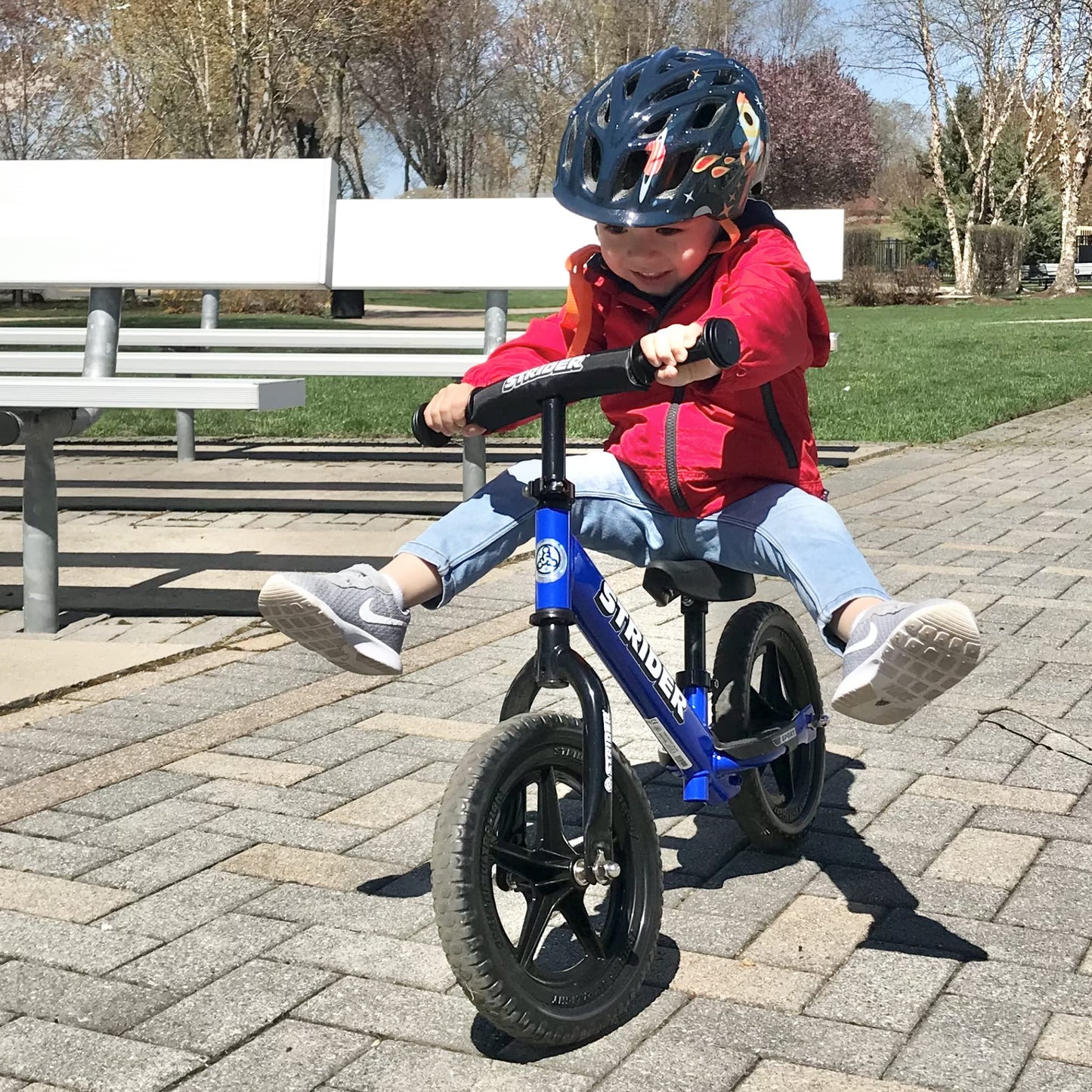 Strider 12” Sport Bike, Blue - No Pedal Balance Bicycle for Kids 1 to 4 Years - Includes Safety Pad, Padded Seat, Mini Grips & Flat-Free Tires - Tool-Free Assembly & Adjustments